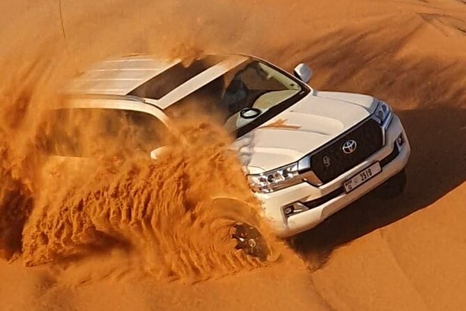 Dubai: Jeep Desert Safari, Camel Ride, and Quad Bike Tour - Stop 2 sandboarding: where the views get fun