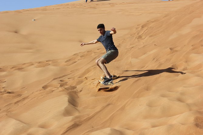 Dubai: Jeep Desert Safari, Camel Ride, and Quad Bike Tour - Al Aweer Camp: BBQ and traditional entertainment