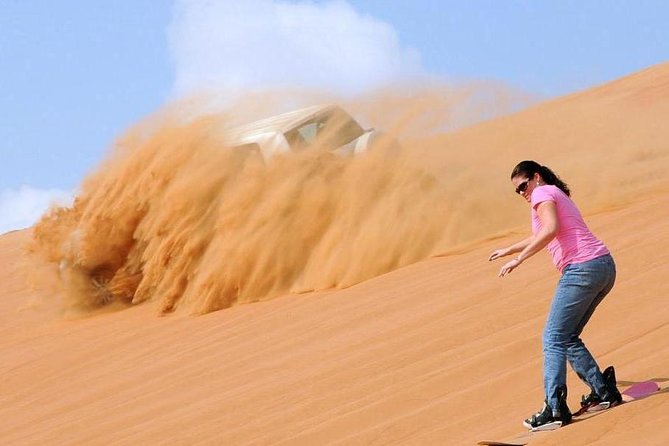 Dubai Morning Safari: Quad Biking, Sandboarding & Camel Ride! - Camel ride + falcon photos: short cultural stops