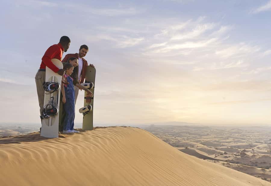 Dubai: Premium Desert Safari, Camel Ride, BBQ & Sandboarding - Camel ride, henna painting, and sandboarding (weather permitting)