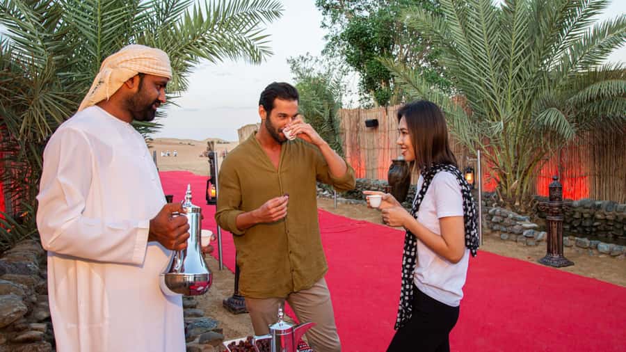 Dubai: Premium Desert Safari, Camel Ride, BBQ & Sandboarding - Live entertainment: belly dance, Tanoura dance, and fire show