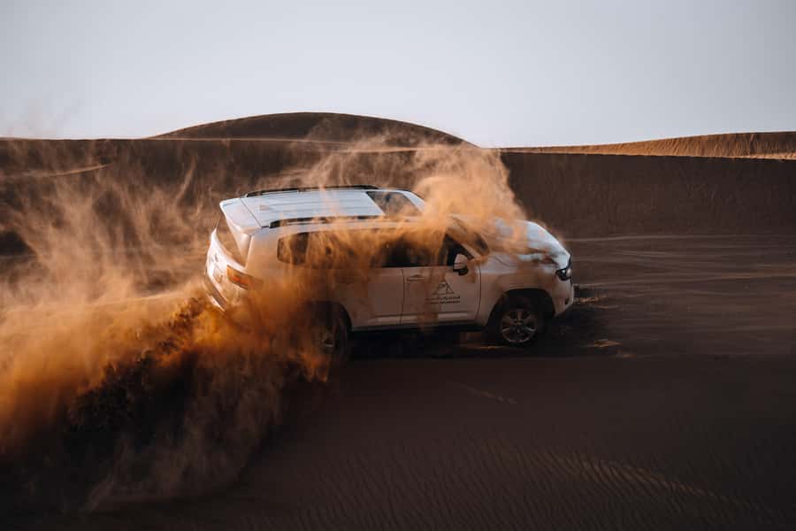 Dubai: Premium Desert Safari, Camel Ride, BBQ & Sandboarding - Fort Lisaili red dunes, wildlife sightings, and the sunset stop that photos love
