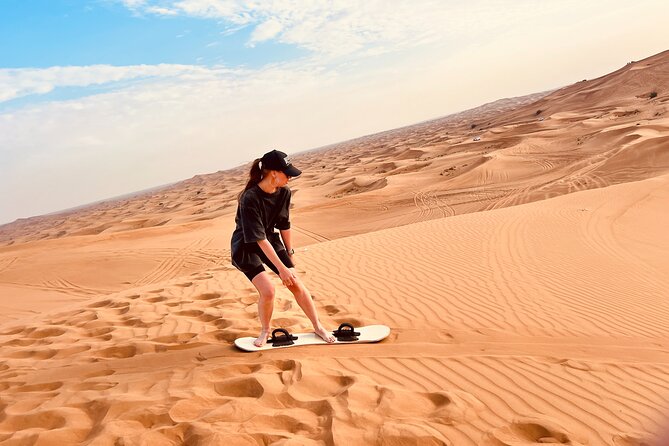 Dubai Premium Desert Safari Red Duns Camel sandbord & Premium BBQ - Evening entertainment: belly dance, Tanora dance, and fire shows under the stars