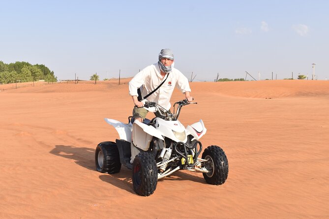 Dubai Premium Red Dunes Safari, Quad Bike, Camels & BBQ - Camp shows: Tanoura, fire show, and belly dance in one night stop