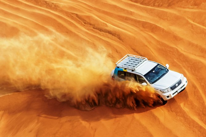 Dubai Private Premium Desert Safari with BBQ Dinner in 4WD - Sandboarding and the sunset build-up: the part most people remember