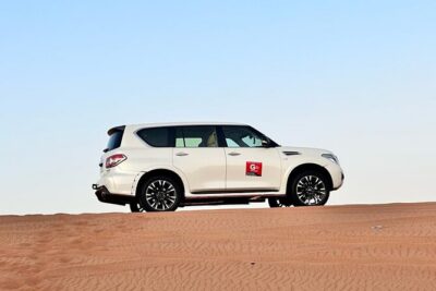 Dubai Red Desert Safari sharing basis with Camel, Shows & Dinner - Pickup, 4x4 transport, and the dune bashing reality check
