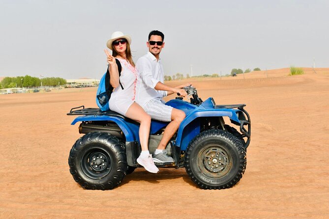 Dubai: Red Dunes Desert Safari, Camel ride, Sandboard, Quad Bike - Dinner and the shows: Tanura, belly dance, and shisha time