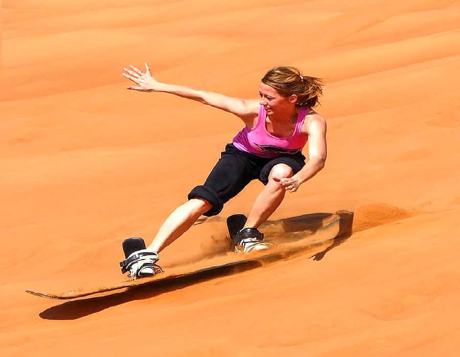 Dubai: Safari, Quad Bike, Camel Ride, and Buffet Dinner - Sandboarding on Golden Slopes: The Fun That Feels Like Sliding