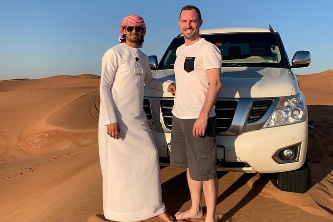 Dubai: Unique SUNSET 4WD Red Dunes Safari - The desert camp dinner: BBQ buffet, shisha, and henna in one package