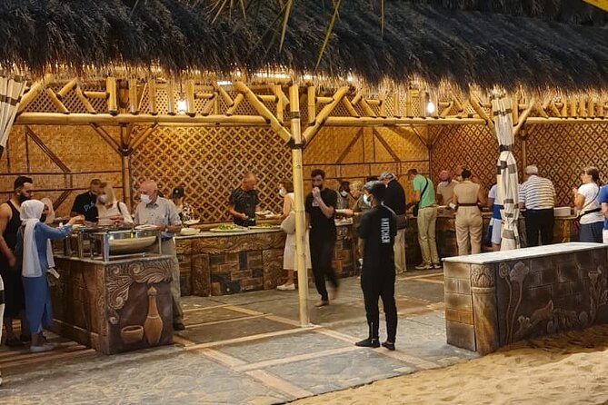 Dubai: Unique SUNSET Buggy Red Dunes Safari - Sandboarding and camel ride: fun, balance, and a slower change of pace