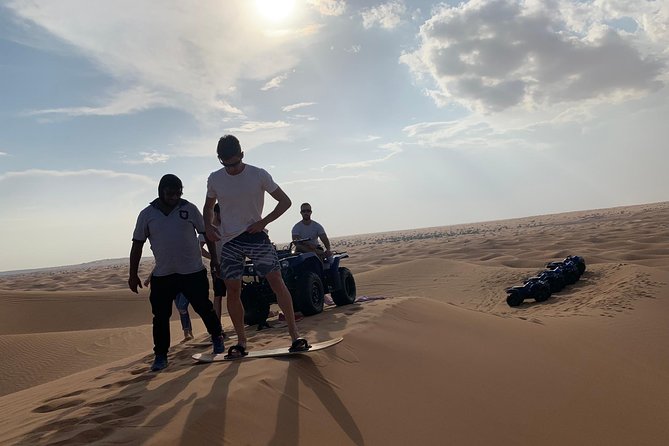 Dubai: Unique SUNSET Quad Bike Red Dunes Safari - Pickup, timing, and what to wear so you don’t suffer