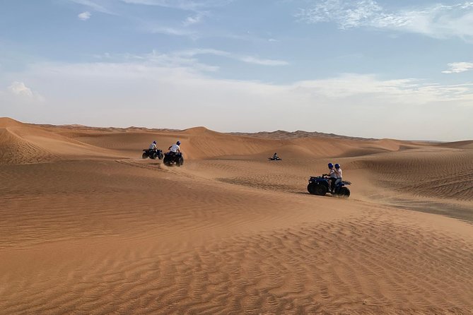 Dubai: Unique SUNSET Quad Bike Red Dunes Safari - The desert camp BBQ: what happens after the rides