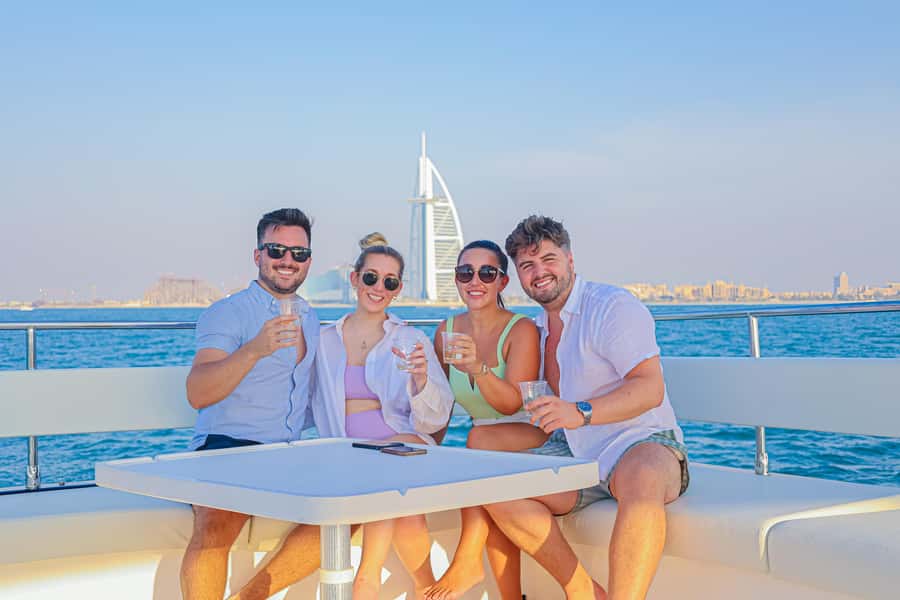Dubai Waves & Dunes: Luxury Yacht Cruise w/ Red Dunes Safari - The Desert Safari Part: Camels, Photo Stop, Sandboarding