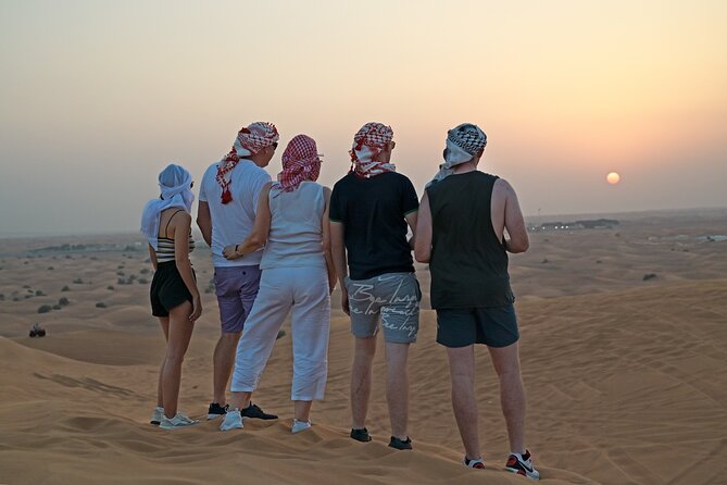 Evening Desert Safari in Dubai, Sandboard & BBQ Dinner - Bedouin camp arrival: sweets, coffee, henna, and a slower rhythm