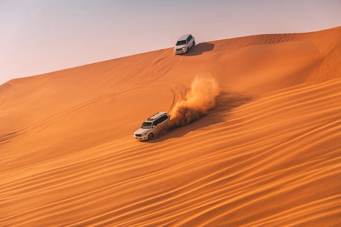 Evening Desert Safari with ATV Quad Bike Dune Bashing BBQ Dinner - Camel ride and Bedouin camp: where the tour slows down
