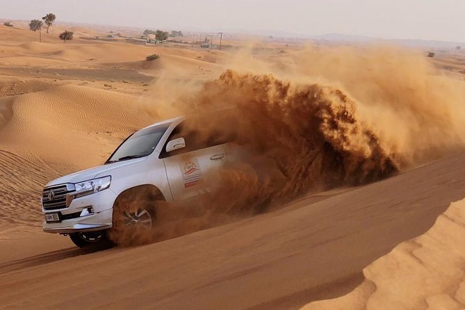 Evening Dubai Safari with BBQ, Dance Shows & Quad Biking optional - The drive out of Dubai: pickup, Land Cruiser comfort, and first dune stops