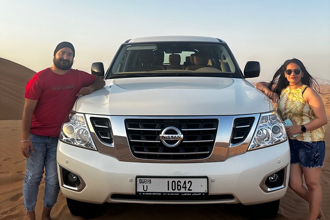 Exclusive Desert Safari Camel Ride Sandboard & Buffet BBQ Dinner - Lahbab Red Dunes: dune bashing, sandboarding, and sunset photo time