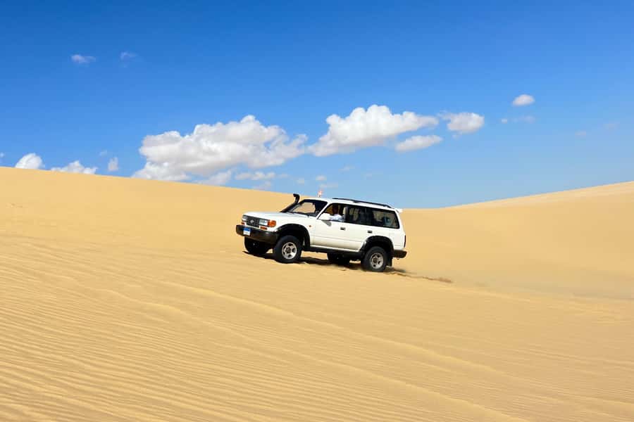 From Cairo: Desert Safari, Camel Ride, Magic Lake, & Lunch - Morning pickup from Cairo or Giza: you’re trading time for a big payoff