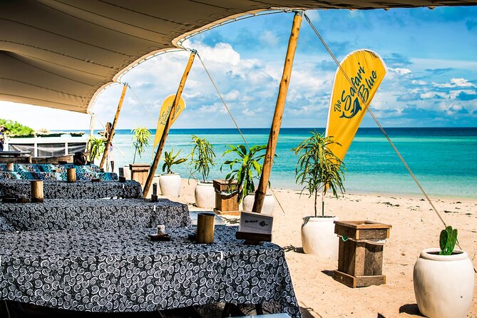 Full-Day Blue Lagoon and Sandbank Boat Tour from Zanzibar ( Safari blue) - Niamembe Island (2 hours): shallow swim, sunbathing, and a calmer finish