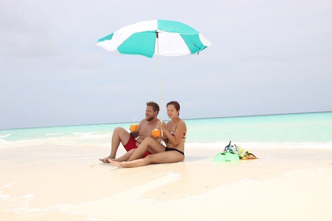 Full-Day Blue Lagoon and Sandbank Boat Tour from Zanzibar ( Safari blue) - Food on the dhow: seafood lunch, fruits, soda, water, and local beers