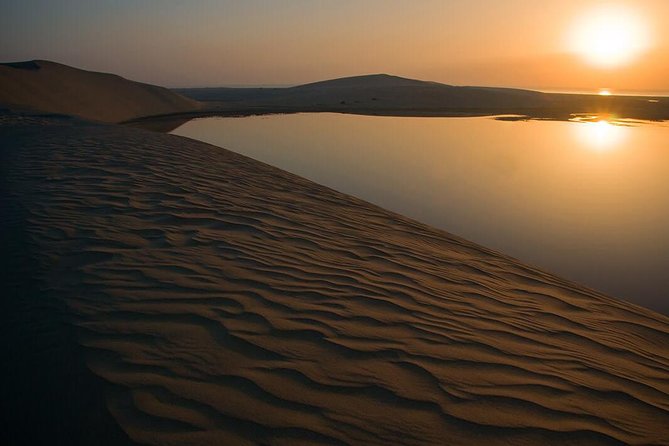 Half Day Desert Safari || Sand Boarding || Camel Ride || Inland Sea Visit || - Inland Sea at Khor al-Udaid: white sand and crystal water