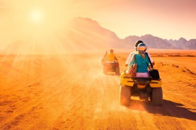 Hurghada: ATV Quad Safari, Camel Ride & Bedouin Village Tour - Reaching the Bedouin Village: tea, camel ride, and mountain sunset mood