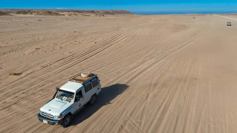 Hurghada: Jeep Safari with Camel Ride, Dinner and Show - Dinner Setup: Fuel Up with Indian Rice, Chicken, Meatballs, and Salads