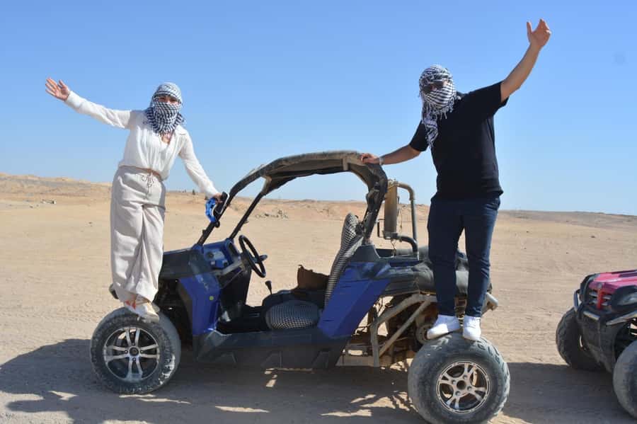 Hurghada: Quad and Buggy Safari with Dinner and Show - Desert sunset from a rooftop: what to do with the wind