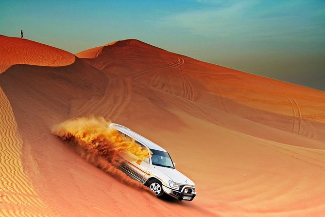 Morning Desert Safari with Camel Ride and Sand boarding - Sandboarding on golden dunes