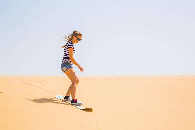 Morning Desert Thrill: Quad Bike Safari Escape - Sandboarding and the short camel ride: the classic desert mix