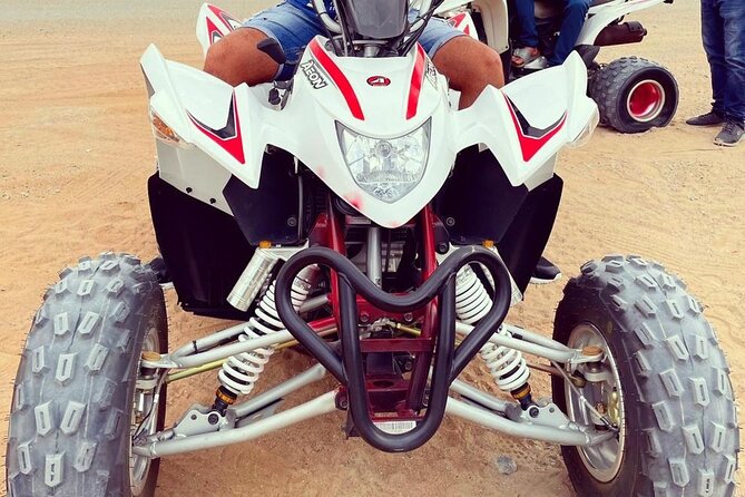 One hour Quad Bike at Red Sand Desert Safari with Camel Ride and BBQ Dinner - Quick hits before you go