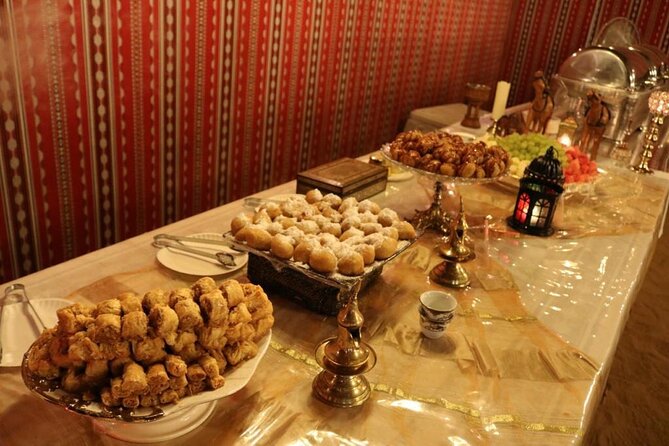 One hour Quad Bike at Red Sand Desert Safari with Camel Ride and BBQ Dinner - Camel Ride, Henna, and Sandboarding: The Desert Slows Down