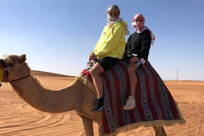 One hour Quad Bike at Red Sand Desert Safari with Camel Ride and BBQ Dinner - Guides Make the Difference: Rashid, Ahmed, and the Rest