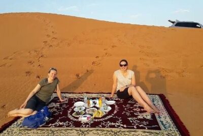 Private 4x4 Sunrise Desert Safari with Camel Ride - Sandboarding on Dubai dunes: fast fun with a couple of realities