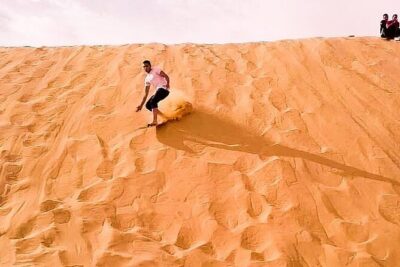 Private Adventure Red Dune Desert Safari With BBQ Dinner & Shows - Sandboarding and camel riding: the calmer desert moments
