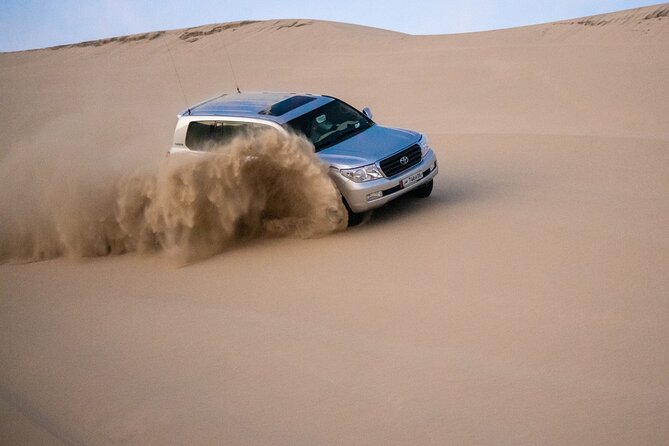 Private Half Day Desert Safari with Camel Ride - Entering the Khor Al Udaid Beach Stop: Desert Meets Sea