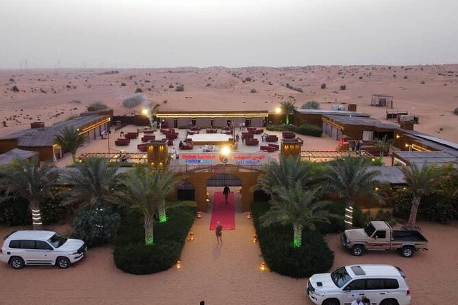Private Sunset Desert Safari:SandSurfing, Camel Ride & BBQ dinner - Camel ride, falcon photo, and the gentle side of the desert