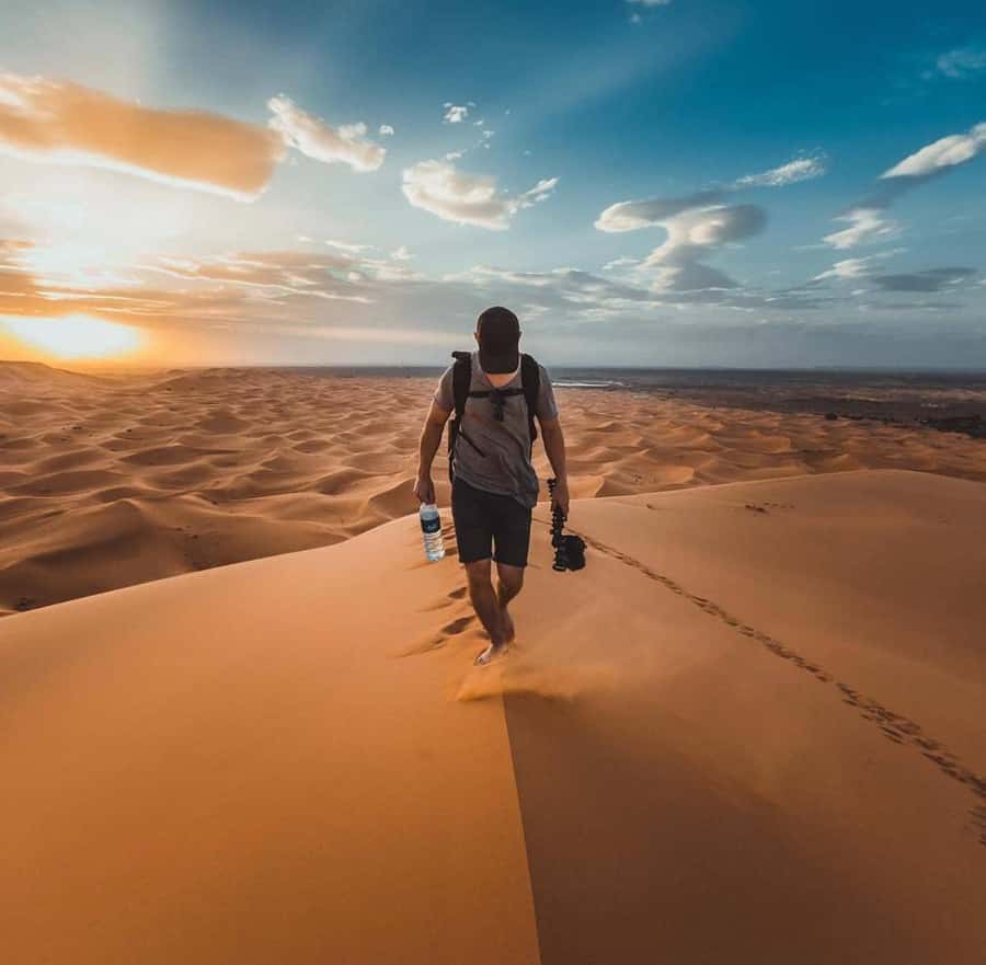 Quad Bike/Buggy, Desert Safari, Camel Ride, Dune Bashing - Sandboarding: sliding down the dunes, not just watching them