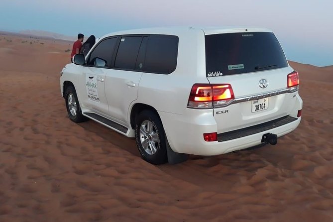 Red Dune Desert Safari & Quad Bike, BBQ Dinner. Camel Ride, Sandboarding - The Burj Khalifa stop: a city anchor before the dunes