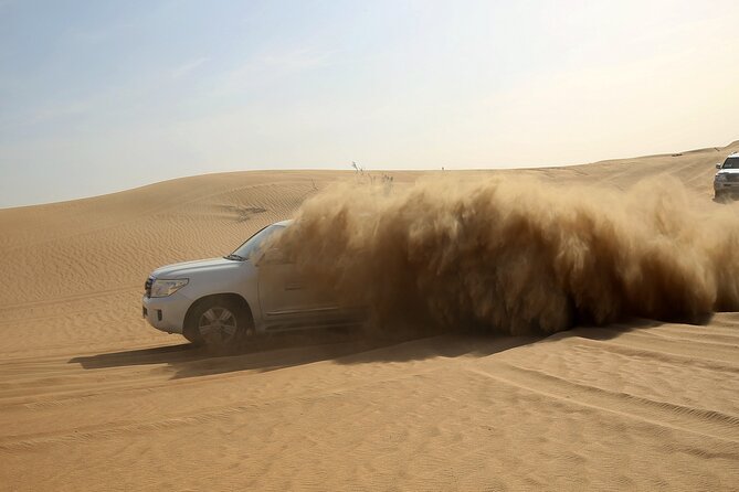 Red Dune Evening Desert Safari with Sandbashing and BBQ Dinner - The 4x4 Dune Bash and Sandboarding/Sand Skiing
