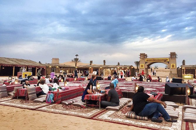 Red Dune Safari Adventure with BBQ Dinner Experience - Desert Camp Activities: Camel Ride, Sandboarding, and Henna