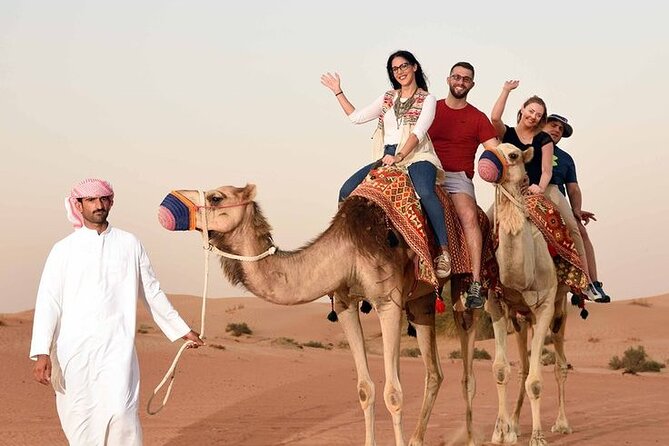 Red Dunes Desert Safari 4x4 Pickup & Drop, Camel Ride BBQ & Shows - BBQ dinner and the show run: fire, dance, and Tanoura