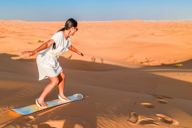 Red Dunes Desert Safari, Sand Board, Camel Ride with BBQ Dinner - Sandboarding and the camel ride: what to expect and what to watch