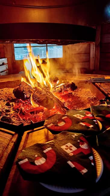 Rovaniemi: Husky Safari with Transfers & BBQ - Warming up in a traditional kota with BBQ and Christmas-style snacks
