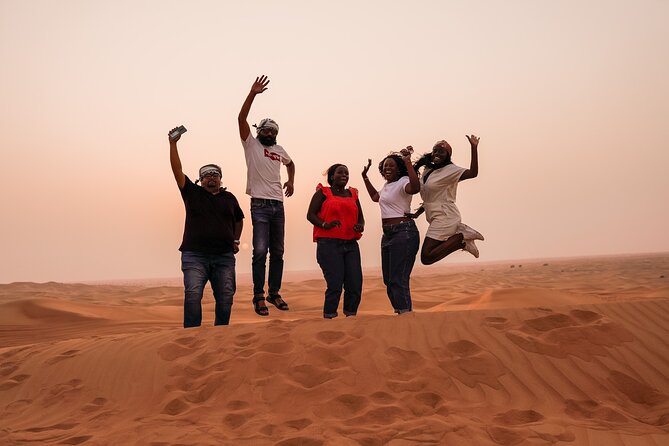 Sunrise Desert Safari - A Magical Morning in Dubai - The sunrise stop on the highest dune, plus sandboarding