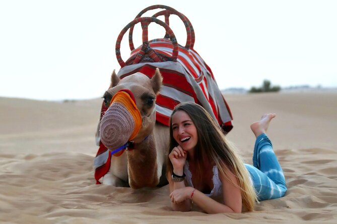 Sunset Camel Trek & Red Dunes Safari with BBQ at Al Khayma Camp From Dubai - Al Khayma Desert Camp: Majilis Seating, Coffee, Dates, and a Falcon Photo