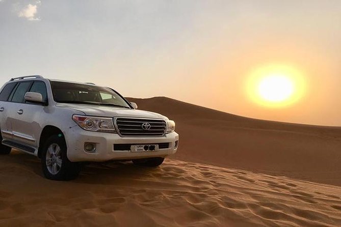 Sunset Desert Safari With BBQ Dinner, Camel Ride, Belly Dancing from Dubai - Lahbab Dunes at Sunset: Dune Bashing and Golden Hour Photos