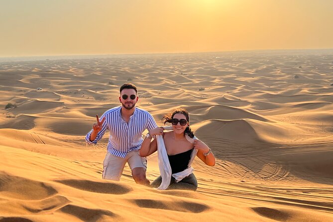 Sunset Safari with BBQ Dune Drive Camel Ride & Dune Buggy option - Falcon Photo Moment and Traditional Outfit Fun