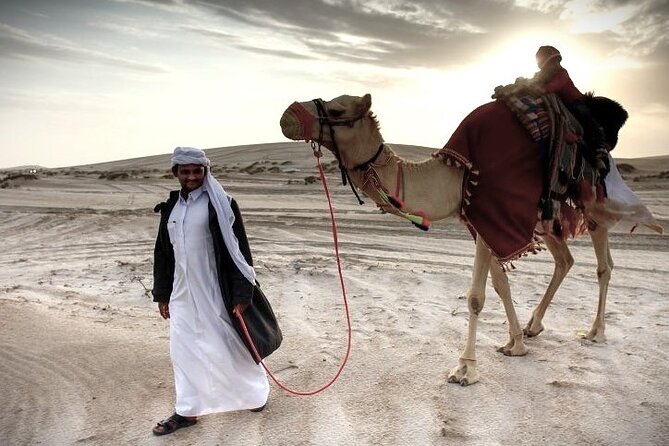 Thrilling 4-Hour Dune Bashing & Camel Ride Safari to Inland Sea - Pickup, stadium glimpses, and why the ride between stops matters